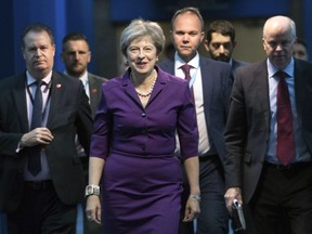 Britain's Prime Minister Theresa May arrives at the Conservative Party annual conference at the International Convention Centre, Birmingham, central England, Tuesday Oct. 2, 2018.