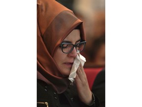 Hatice Cengiz, the fiancee of the killed Saudi journalist Jamal Khashoggi, reacts during a memorial event for her fiancee at the Mechanical Engineers Institute in London, Monday Oct. 29, 2018.  The Al Sharq Forum think tank and Middle East Monitor have organised the event in honour of the murdered journalist Khashoggi who died in the Saudi consulate in Turkey.