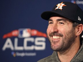 Houston Astros starting pitcher Justin Verlander smiles during a news conference prior to a workout at Fenway Park, Friday, Oct. 12, 2018, in Boston. The Astros face the Boston Red Sox in Game 1 of baseball's American League Championship Series on Saturday.