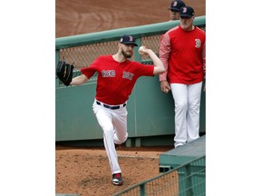 Boston Red Sox starting pitcher Chris Sale throws in the bullpen during a baseball workout at Fenway Park, Wednesday, Oct. 3, 2018, in Boston. The Red Sox face the winner of the Oakland Athletics-New York Yankees wild card game in the American League division series on Friday.