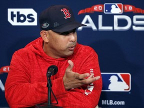 Boston Red Sox manager Alex Cora speaks to media during a baseball workout at Fenway Park, Wednesday, Oct. 3, 2018, in Boston. The Red Sox face the winner of the Oakland Athletics-New York Yankees wild card game in the American League division series on Friday.