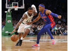 Boston Celtics forward Marcus Morris (13) drives against Detroit Pistons guard Bruce Brown (6) during the first half of an NBA basketball game, Tuesday, Oct. 30, 2018, in Boston.