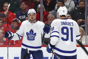 Maple Leafs' Auston Matthews (left) celebrates his goal with John Tavares on Thursday against the Red Wings in Detroit. (AP PHOTO)