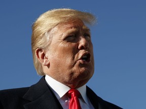 President Donald Trump speaks to media on the tarmac before boarding Air Force One, Thursday, Oct. 18, 2018, in Andrews Air Force Base, Md., en route to speak at a campaign rally in Neptune Aviation Services, Missoula, Mont.