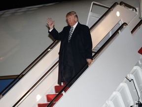 President Donald Trump dismbarks from Air Force One, Saturday, Oct. 20, 2018, in Andrews Air Force Base, Md., en route to Washington returning from a campaign rally in Elko, Nev.