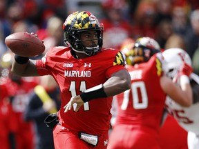 Maryland quarterback Kasim Hill throws to a receiver in the first half of an NCAA college football game against Rutgers, Saturday, Oct. 13, 2018, in College Park, Md.