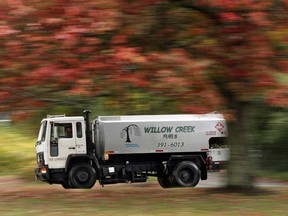 A heating oil delivery truck travels down a road in South Portland, Maine, Thursday, Oct. 11, 2018. With winter on its way, heating oil keeps growing more costly as several top oil-producing countries remain in political or economic turmoil. The Governor's Energy Office says the average statewide cash price is now $2.96, 78 cents per gallon higher than a year ago.