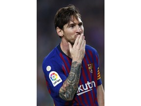 FC Barcelona's Lionel Messi celebrates after scoring during the Spanish La Liga soccer match between FC Barcelona and Sevilla at the Camp Nou stadium in Barcelona, Spain, Saturday, Oct. 20, 2018.