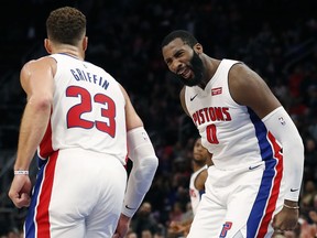 Detroit Pistons center Andre Drummond (0) reacts after a basket by forward Blake Griffin (23) during the first half of an NBA basketball game against the Philadelphia 76ers, Tuesday, Oct. 23, 2018, in Detroit.