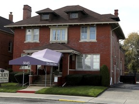 This Saturday, Oct. 20, 2018 photo shows the Perry Funeral home in Detroit. Using a search warrant, the Detroit Police removed 63 remains of fetuses from the funeral home near Wayne State University on Friday, Oct. 19, 2018. A widening investigation of alleged improprieties at local funeral homes is underway.