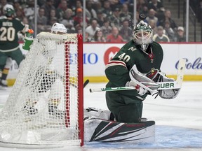 Minnesota Wild goalie Devan Dubnyk stops a shot on goal by the Vegas Golden Knights in the first period during an NHL hockey game Saturday, Oct. 6, 2018, in St. Paul, Minn.