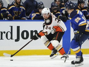 Anaheim Ducks' Sam Steel (34) skates by St. Louis Blues' Vince Dunn (29) during the first period of an NHL hockey game, Sunday, Oct. 14, 2018, in St. Louis.