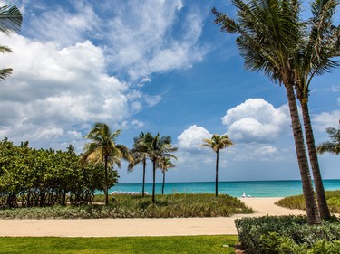 A walking path runs alongside the beach at Bal Harbour.