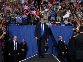 President Donald Trump arrives to speak at a campaign rally at the Landers Center Arena, Tuesday, Oct. 2, 2018, in Southaven, Miss.