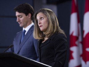 Chrystia Freeland, Canada's minister of foreign affairs, right, speaks as Justin Trudeau, Canada's prime minister, listens during a news conference to disucss Nafta agreements in Ottawa, Ontario, Canada, on Monday, Oct. 1, 2018.