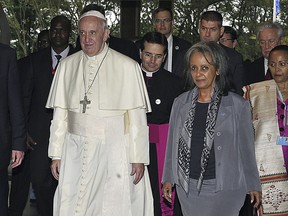 FILE - In this Thursday, Nov. 26, 2015 file photo, Pope Francis walks next to then Director-General of the United Nations Office at Nairobi (UNON) Sahle-Work Zewde, right, upon his arrival there in Nairobi, Kenya. Ethiopian lawmakers unanimously elected the seasoned diplomat Sahle-Work Zewde as the country's first female president, a largely ceremonial post, on Thursday, Oct. 25, 2018.