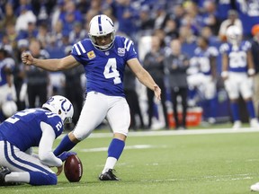 Indianapolis Colts kicker Adam Vinatieri (4) boots a field goal from the hold of Rigoberto Sanchez during the first half of an NFL football game against the Buffalo Bills in Indianapolis, Sunday, Oct. 21, 2018.