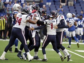 Houston Texans kicker Ka'imi Fairbairn (7) celebrates with teammates after kicking the game winning field goal during overtime of an NFL football game against the Indianapolis Colts, Sunday, Sept. 30, 2018, in Indianapolis. Houston won 37-34.