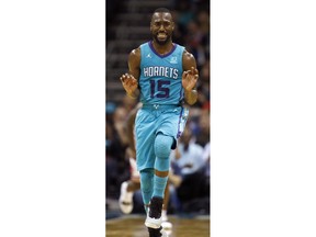 Charlotte Hornets' Kemba Walker (15) celebrates one of his three pointers against the Chicago Bulls during the second half of an NBA basketball game in Charlotte, N.C., Friday, Oct. 26, 2018. Charlotte won 135-106.