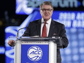 Commissioner John Swofford speaks to the media during a news conference at the Atlantic Coast Conference NCAA college basketball media day in Charlotte, N.C., Wednesday, Oct. 24, 2018.