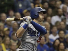 Los Angeles Dodgers' Cody Bellinger chits a two-run home run during the second inning of Game 7 of the National League Championship Series baseball game against the Milwaukee Brewers Saturday, Oct. 20, 2018, in Milwaukee.