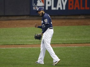 Milwaukee Brewers relief pitcher Jeremy Jeffress (32) reacts after a double play during the seventh inning of Game 2 of the National League Championship Series baseball game against the Los Angeles Dodgers Saturday, Oct. 13, 2018, in Milwaukee.