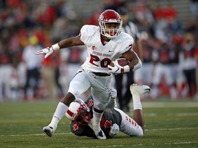 Fresno State running back Ronnie Rivers (20) eludes New Mexico safety Bijon Parker (4) before scoring a touchdown during the first half of an NCAA college football game in Albuquerque, N.M., Saturday, Oct. 20, 2018.