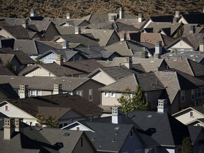 In this Oct. 12, 2018, photo, homes fill a small a valley on the outskirts of Reno, Nev. Silicon Valley firms from Apple to Tesla have set up operations in the Reno area, bringing waves of well-paid tech and manufacturing workers which in turn helps to raise home prices and rents.