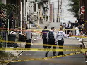 FILE - In this Monday, Oct. 1, 2018 file photo, authorities investigate the scene of Saturday's fatal car explosion in Allentown, Pa. Officials with the federal Bureau of Alcohol, Tobacco, Firearms and Explosives are holding a news conference Thursday, Oct. 4 with prosecutors and Allentown police.