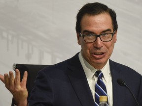 ILE - In this July 22, 2018 file photo, U.S. Treasury Secretary Steven Mnuchin speaks during a news conference at the G20 meeting of Finance Ministers and Central Bank governors in Buenos Aires, Argentina.  The Treasury Department has issued new rules on foreign investments into American companies that will give the government more power to block foreign transactions on national security grounds. The rules represent the latest escalation in an intensifying economic conflict between the United States and China.