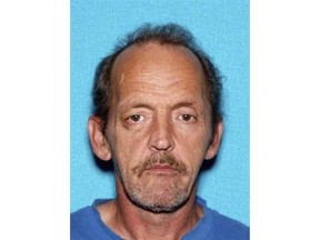 This photo provided by Montgomery County Sheriff's Office shows Kirby Gene Wallace.  Authorities say they're closing in on Wallace, a multiple-murder suspect in Tennessee, using helicopters and dogs in rugged terrain. Wallace has been spotted for a third time in Stewart County, where Sheriff Frankie Gray says his deputies are using K-9 units to encircle the suspect in a heavily wooded area. (Montgomery County Sheriff's Office via AP)
