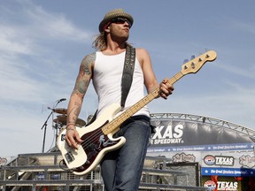 FILE - In this April 9, 2011 file photo, 3 Doors Down' bassist Todd Harrell performs before a NASCAR auto race at Texas Motor Speedway in Fort Worth, Texas. Harrell, the founding member and former bassist of the rock band 3 Doors Down has been sentenced to 10 years in Mississippi state prison for possession of a firearm by a felon. News outlets report Jackson County Circuit Court Judge Robert Krebs gave Todd Harrell the maximum penalty during a hearing Thursday, Oct. 11, 2018.