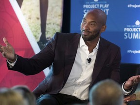 FILE - In this Tuesday, Oct. 16, 2018 file photo, former NBA basketball all-star Kobe Bryant gestures as he moderates a panel about youth sports during the Aspen Institute's Project Play Summit in Washington. Kobe Bryant has been dropped from the jury of an animated film festival after calls for the former NBA star's ouster over a 2003 rape allegation. The CEO of the organization behind the Animation Is Film Festival said in a statement Wednesday, Oct. 17, 2018 that the festival's stakeholders decided to drop Bryant to keep its focus on films.