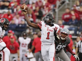 FILE - In this Sept. 29, 2018, file photo, Utah quarterback Tyler Huntley (1) throws a pass in front of Washington State defensive end Will Rodgers III (92) during the second half of an NCAA college football game in Pullman, Wash. Utah, which plays Stanford this week, is averaging just 16 points per game against FBC competition as Huntley hasn't thrown a TD pass since a season-opening win against FCS-level Weber State.