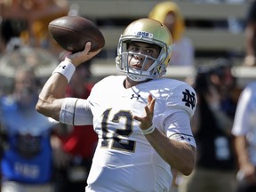 FILE - In this Sept. 22, 2018, file photo, Notre Dame's Ian Book looks to pass against Wake Forest during the first half of an NCAA college football game in Winston-Salem, N.C. Book has gone from lightly recruited to the orchestrator of a high-powered offense for the nation's No. 5-ranked team.  Notre Dame hosts Pittsburgh on Saturday.
