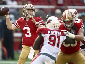 FILE - In this Oct. 7, 2018, file photo, San Francisco 49ers quarterback C.J. Beathard (3) throws a pass against the Arizona Cardinals during the second half of an NFL football game in Santa Clara, Calif. Beathard, who took over at quarterback after a season-ending knee injury to Jimmy Garoppolo, and the 49ers play the Green Bay Packers this week.