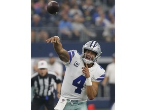 FILE - In this Sept. 30, 2018, file photo, Dallas Cowboys quarterback Dak Prescott (4) passes against the Detroit Lions in the first half of an NFL football game in Arlington, Texas. Prescott and the Dallas passing game haven't been very efficient through five games, which helps explain a losing record.