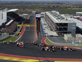 FILE - In this Nov. 18, 2012, file photo, Red Bull driver Sebastian Vettel, of Germany, leads the field into the first turn for the start of the Formula One U.S. Grand Prix auto race at the Circuit of the Americas, in Austin, Texas. At 7 years old, Austin and the Circuit of the America beat as the heart of Formula One in the U.S.