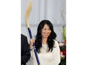 FILE - In this April 13, 2013, file photo, Kim Pegula poses during groundbreaking ceremonies at First Niagara Center in Buffalo, N.Y. The NHL is finally shrugging off its reputation as being a `men-only' club with the Maple Leafs hiring Hayley Wickenheiser to a player development role, and Kim Pegula taking over as president of the Buffalo Sabres.