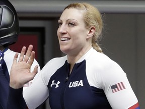 FILE - In this Feb. 20, 2018, file photo, Jamie Greubel Poser gestures after a heat in the women's two-man bobsled competition at the 2018 Winter Olympics in Pyeongchang, South Korea. Poser has retired after an 11-year career in which she won a bronze medal at the Sochi Olympics. She made the announcement Friday, Oct. 19, 2018,  through USA Bobsled and Skeleton.