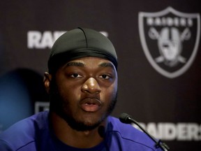 FILE - In this Oct. 12, 2018, file photo, Oakland Raiders wide receiver Amari Cooper speaks during a press conference at the Hilton London Wembley hotel in London. The Dallas Cowboys have acquired Oakland receiver Amari Cooper for a first-round draft pick. Raiders general manager Reggie McKenzie said Monday, Oct. 22, 2018, his team will get the pick in the 2019 draft.