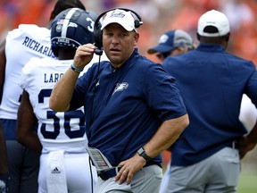 FILE - In this Sept. 15, 2018, file photo, Georgia Southern head coach Chad Lunsford works the sideline during the second half of an NCAA college football game against Clemson, in Clemson, S.C. The first AP Top 25 ranking in Appalachian State's will be on the line, as well as the path to a Sun Belt championship, when the No. 25 Mountaineers visit Georgia Southern on Thursday night.