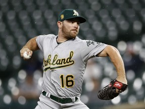 FILE - In this Sept. 12, 2018, file photo, Oakland Athletics starting pitcher Liam Hendriks throws to the Baltimore Orioles in the first inning of a baseball game, in Baltimore. Reliever Liam Hendriks will start for the Oakland Athletics in Wednesday night's , Oct. 3, AL wild-card game against the New York Yankees. Hendriks will be only the fourth pitcher to start a postseason game after a regular season of no wins, according to the Elias Sports Bureau.