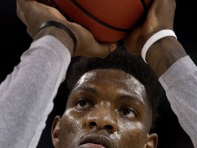 FILE - In this March 14, 2018, file photo, Kansas forward Silvio De Sousa practices for an NCAA college basketball first round game, in Wichita, Kan. Kansas forward Silvio De Sousa, whose name surfaced as part of the FBI's investigation into corruption in college basketball, will be withheld from competition pending a review of his eligibility. Jayhawks coach Bill Self said in a statement before appearing at the Big 12's annual media day Wednesday, Oct. 24,2018,  that the sophomore forward would be held out beginning with Thursday's exhibition game.