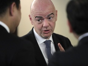 FILE - In this  Monday, June 11, 2018 file photo, FIFA President Gianni Infantino speaks with participants of the Asian Football Confederation (AFC) meeting in Moscow, Russia. A person with knowledge of the plans tells The Associated Press FIFA President Gianni Infantino is doubling down on his Club World Cup plans with a proposal for an annual tournament despite European soccer's resistance to any competition that challenges the supremacy of the Champions League.