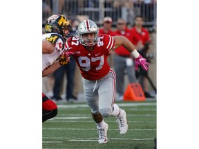 FILE - In this Oct. 7, 2017, file photo, Ohio State defensive end Nick Bosa plays against Maryland during an NCAA college football game, in Columbus, Ohio. Bosa's college football career is over. The injured All-American defensive end intends to withdraw from Ohio State to spend time rehabilitating and training for an NFL career. He is expected to be a first-round draft pick. No. 2 Ohio State made the announcement on Tuesday, Oct. 16, 2018..