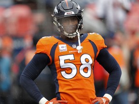 FILE - In this Oct. 14, 2018, file photo, Denver Broncos linebacker Von Miller (58) warms up prior to an NFL football game against the Los Angeles Rams, in Denver. The Arizona Cardinals can't run the ball, the Denver Broncos can't stop the run. The ground game could be the deciding factor when the two struggling teams meet Thursday night, Oct. 18.