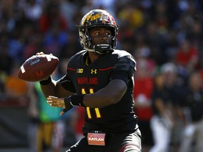 FILE - In this Sept. 23, 2017, file photo, Maryland quarterback Kasim Hill throws to a receiver in the first half of an NCAA college football game against Central Florida in College Park, Md. Maryland interim coach Matt Canada has used both his quarterbacks in all five games this season, jockeying between Kasim Hill and Tyrrell Pigrome in an unyielding effort to get more production from an offense that has relied far too heavily on the run.