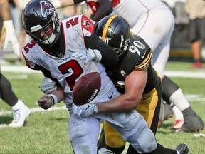 FILE - In this Oct. 7, 2018, file photo, Pittsburgh Steelers linebacker T.J. Watt (90) sacks Atlanta Falcons quarterback Matt Ryan (2) and forces a fumble that was later recovered for a touchdown in the fourth quarter of an NFL football game, in Pittsburgh. The Falcons, who play against the Tampa Bay Buccaneers on Sunday, are off to their worst start since 2013.