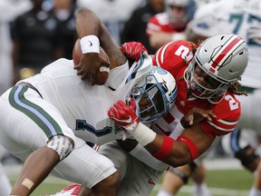 FILE - In this Sept. 22, 2018, file photo, Ohio State defensive end Chase Young, right, sacks Tulane quarterback Jonathan Banks during the first half of an NCAA college football game, in Columbus, Ohio.n Indiana plays at Ohio State on Saturday, Oct. 6.